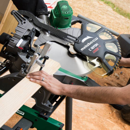 Metabo HPT C12FDHSM 15 Amp 12in Dual Compound Mitre Saw with Laser Marker showing in use cutting molding