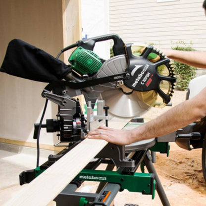 Metabo HPT C12FDHSM 15 Amp 12in Dual Compound Mitre Saw with Laser Marker showing in use cutting wood stud