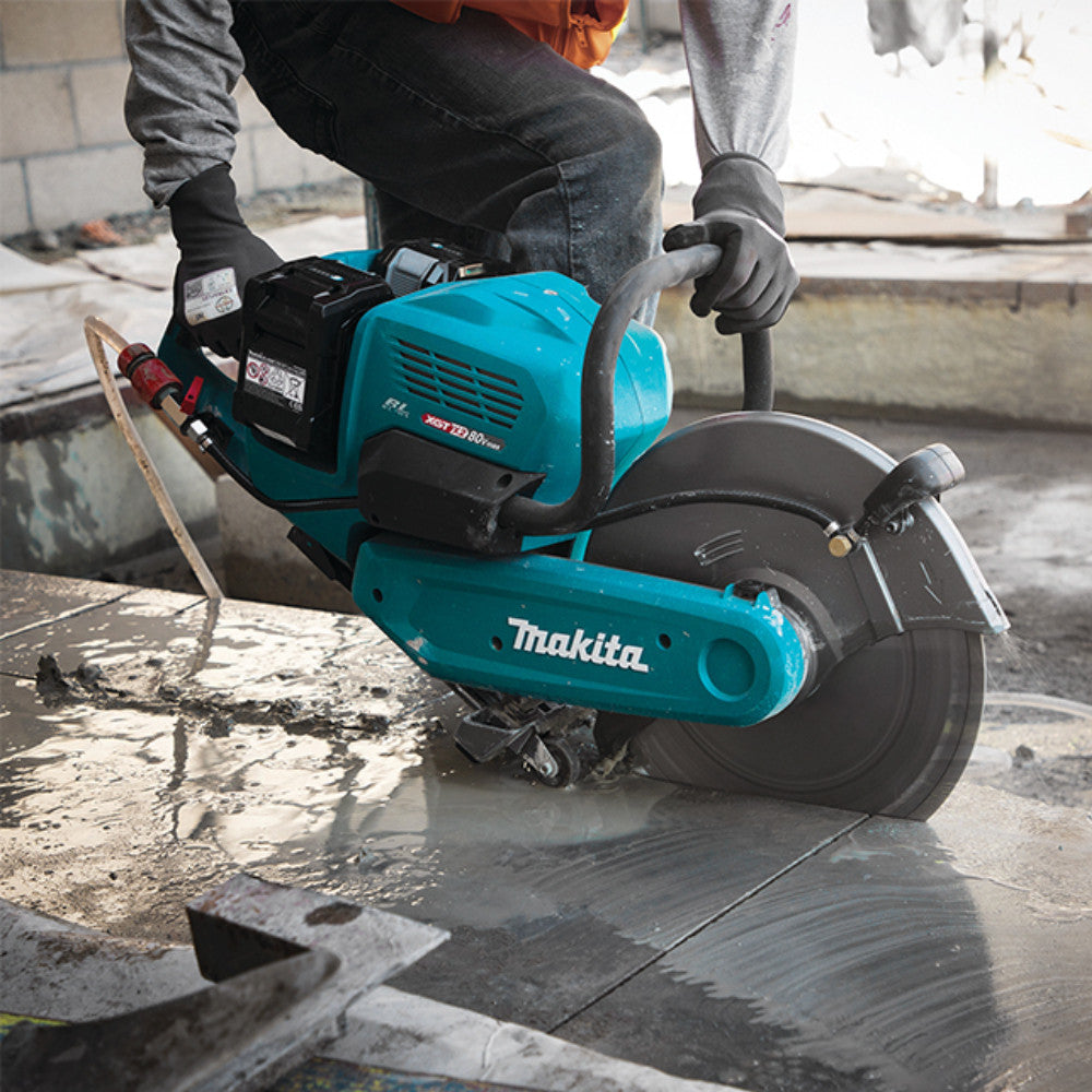 Makita CE001GL401 80V Max (40Vx2) XGT Cordless Brushless 14 inch Power Cutter Kit showing in use cutting into a slab of concrete