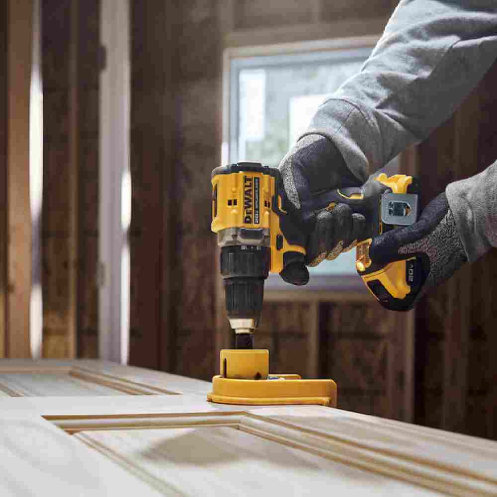DeWalt DCD794D1 ATOMIC COMPACT SERIES 20V MAX Cordless Brushless 1/2 inch Drill/Driver Kit showing in use drilling hole for door knob