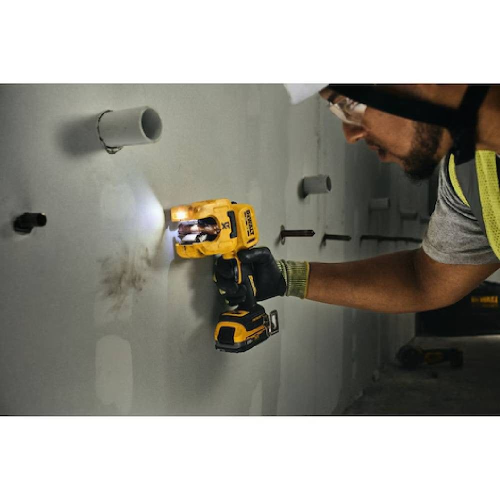 DeWalt DCE154B 20V MAX XR Cordless 1-1/4in Copper Tubing Cutter (Tool Only) showing in use cutting copper pipe coming from a interior wall with full articulating head (Battery sold separately)