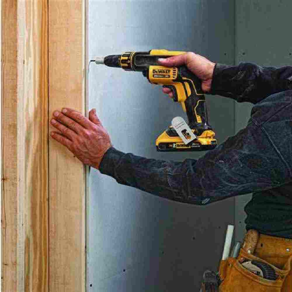 DeWalt DCF630B 20V MAX XR Cordless Brushless Drywall Screwgun (Tool Only) showing in use attaching drywall to a wooden stud wall