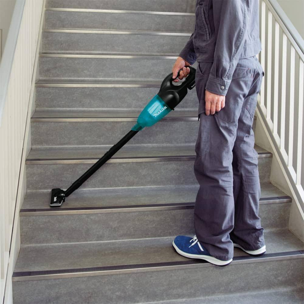 Makita DCL180ZB 18V LXT Cordless Stick Vacuum Cleaner (Tool Only) showing vacuum in use cleaning car seat clean