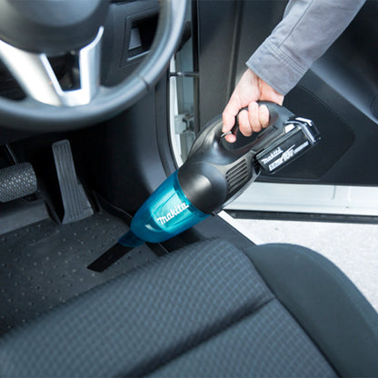 Makita DCL180ZB 18V LXT Cordless Stick Vacuum Cleaner (Tool Only) showing vacuum in use cleaning car seat clean