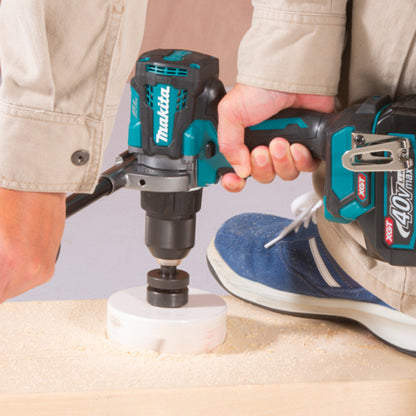 Makita DF001GZ 40V XGT Cordless Brushless 1/2 inch Drill / Driver (Tool Only) showing in use drilling a hole into wood panel with a hole saw (Hole saw sold separately)