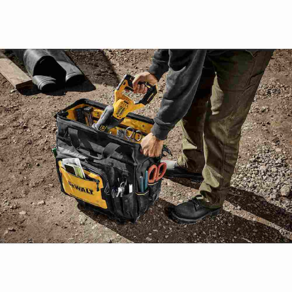 DeWalt DWST560107 18 inch Rolling Tool Bag showing with tools loaded in bag on jobsite (Tools sold separately)