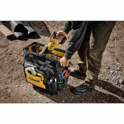 DeWalt DWST560107 18 inch Rolling Tool Bag showing with tools loaded in bag on jobsite (Tools sold separately)