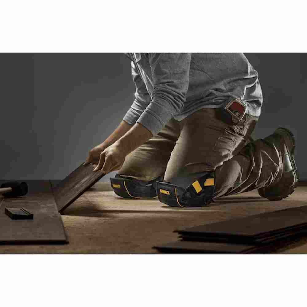 DeWalt DWST590014 Flooring Knee Pads showing being worn by a contractor installing planked flooring