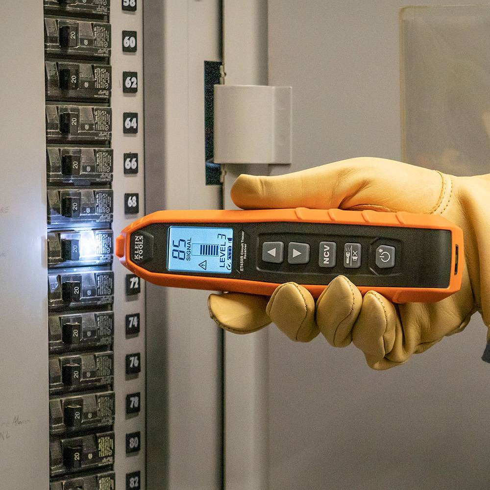Klein Tools ET450 Advanced Circuit Tracer Kit showing in use tracing circuit in breaker box