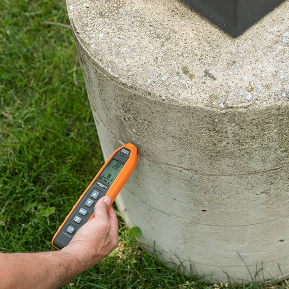 Klein Tools ET450 Advanced Circuit Tracer Kit showing in use tracing circuit in concrete