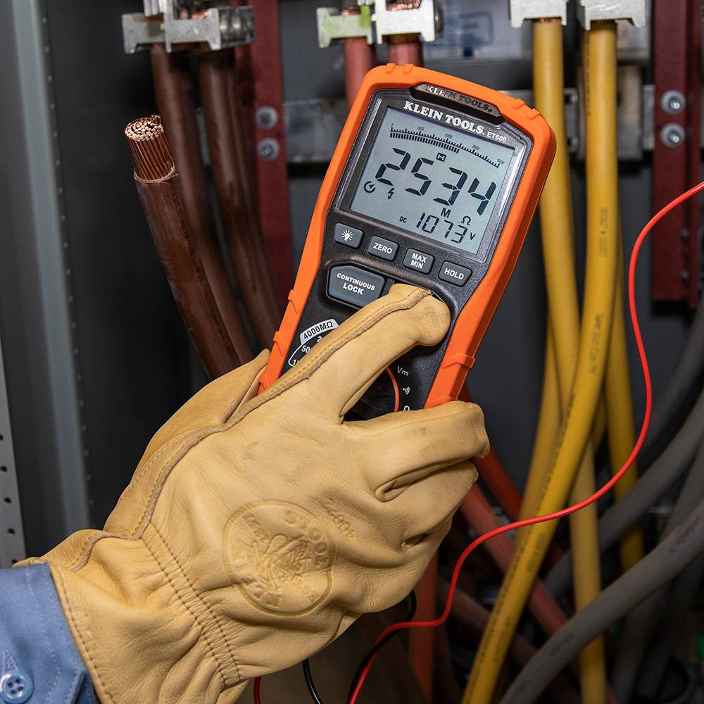 Klein Tools ET600 Digital Insulation Resistance Tester Multimeter showing in use testing cables in junction box