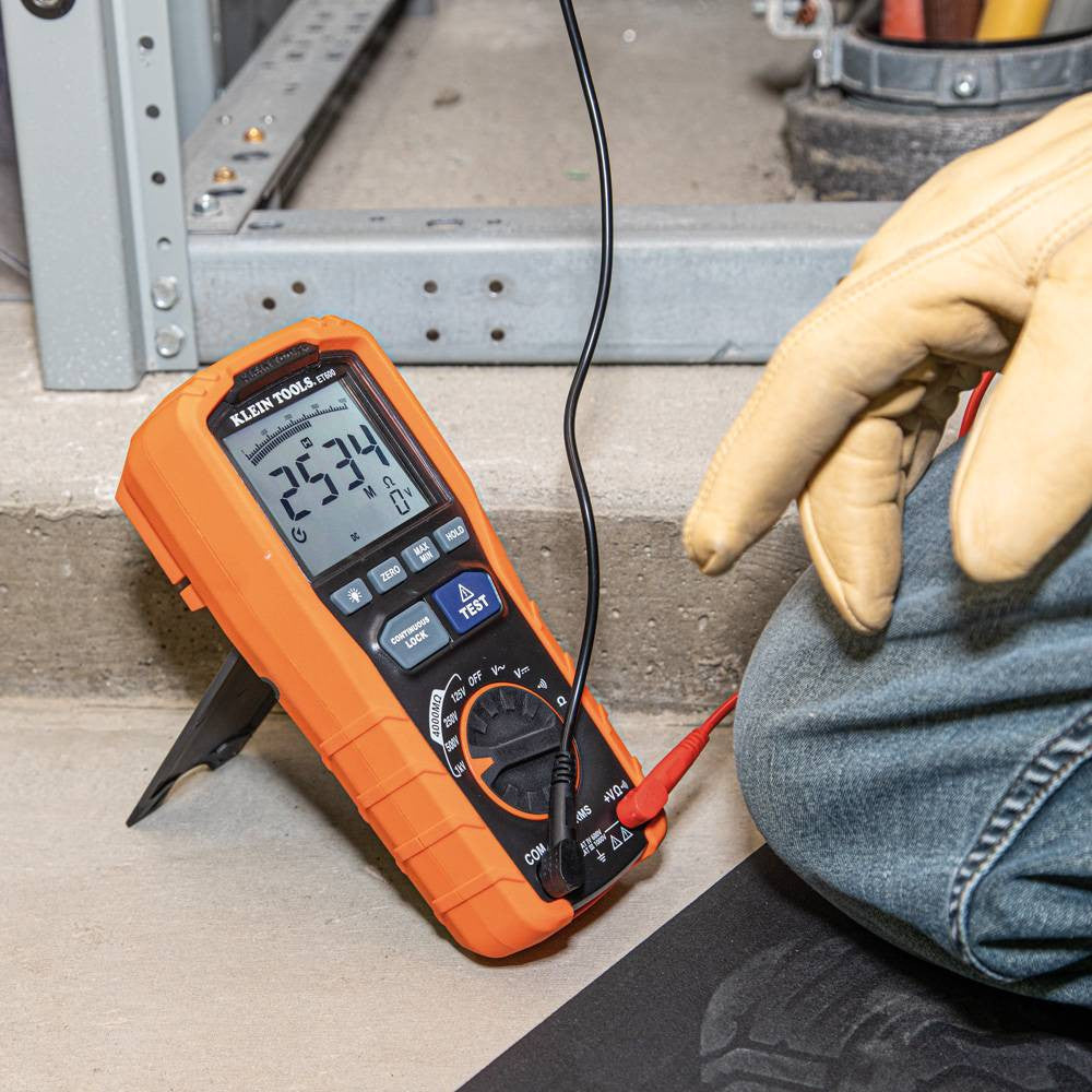 Klein Tools ET600 Digital Insulation Resistance Tester Multimeter showing in use testing electrical cables with the leads