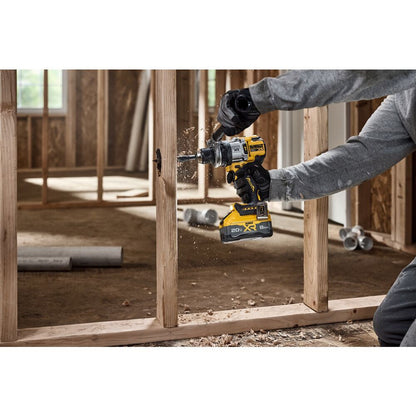 DeWalt DCD1007B 20V MAX XR Cordless Brushless 1/2 Inch 3-Speed Hammer Drill (Tool Only) showing in use drilling through a wood stud