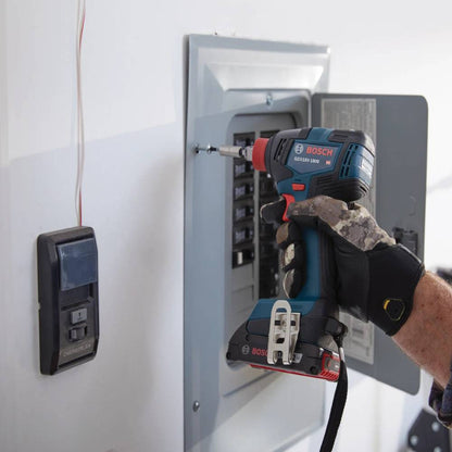 Bosch GDX18V-1800B12 18V Two-In-One 1/4 inch and 1/2 inch Bit/Socket Impact Driver/Wrench Kit showing in use fastening an electrical box to the wall