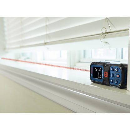 Bosch GLM165-22 BLAZE 165 feet Laser Measure showing in use measuring the opening of a window