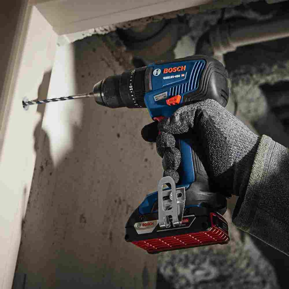 Bosch GSB18V-490N 18V EC Cordless Brushless 1/2 inch Hammer Drill/Driver (Tool Only) showing in use drilling a hole into concrete wall