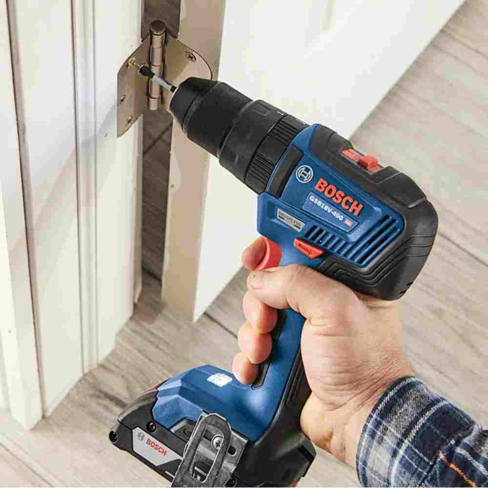 Bosch GSB18V-490N 18V EC Cordless Brushless 1/2 inch Hammer Drill/Driver (Tool Only) showing in use driving screw to fasten a door hinge