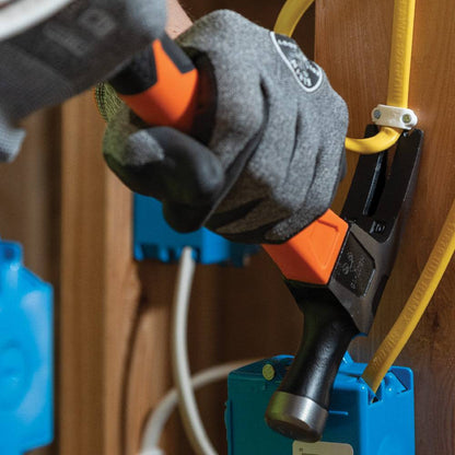 Klein Tools H80718 15 Inch 18oz Straight-Claw Electrician's Hammer showing in use pulling cable bracket staples