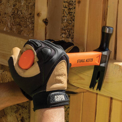 Klein Tools H80718 15 Inch 18oz Straight-Claw Electrician's Hammer showing in use pulling a nail out of a wood stud