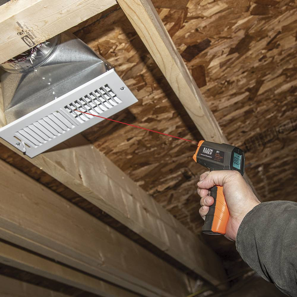 Klein Tools IR1 10:1 Infrared Digital Thermometer with Targeting Laser showing in use showing heat around air duct
