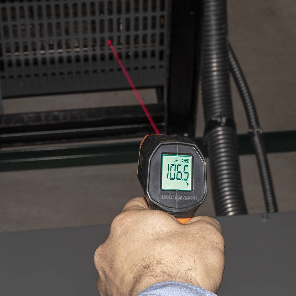 Klein Tools IR1 10:1 Infrared Digital Thermometer with Targeting Laser showing in use reading heat at vent of furnace