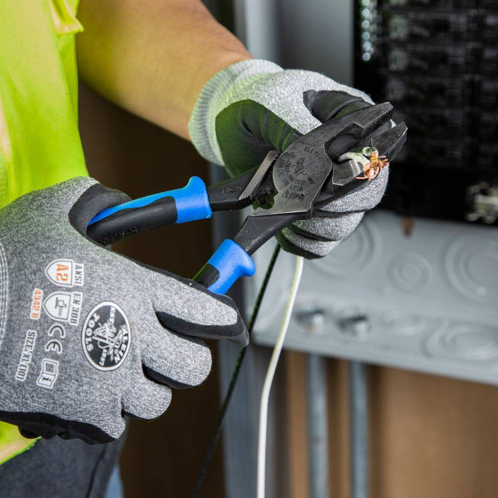 Klein Tools J2000-9NECRTP 2000 Series 9-1/2 inch Lineman's Side-Cutting Pliers showing in use cutting electrical wires