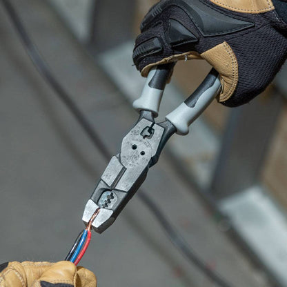 Klein Tools J2159CRTP Hybrid Pliers with Crimper, Fish Tape Puller and Wire Stripper showing in use twisting wires together