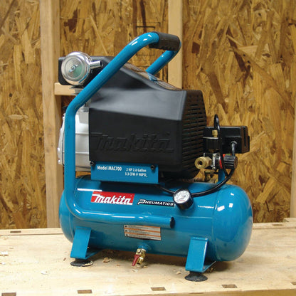 Makita MAC700 12.4 Amp 2 HP Big Bore 2.6 Gallon Air Compressor showing compressor seating on jobsite between usage