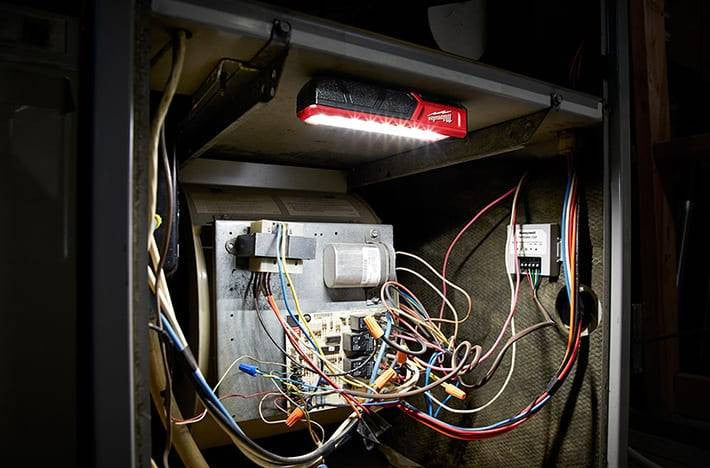 Milwaukee 2112-21 USB Rechargeable ROVER 455 Lumen Pocket Flood Light lighting the work area