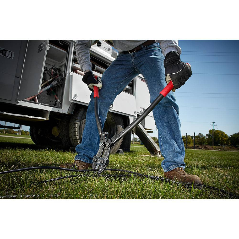 Milwaukee 48-22-4024 24 inch Bolt Cutter showing in use cutting heavy duty cable