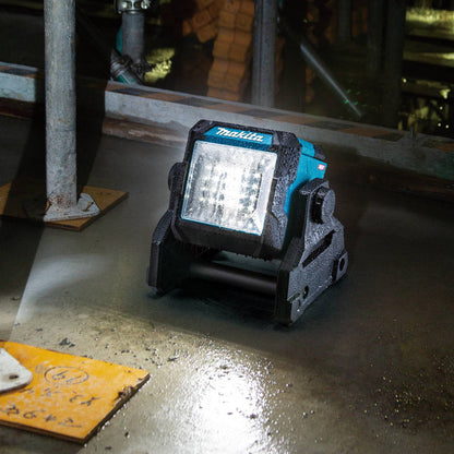 Makita ML003G 18V LXT / 40V MAX XGT Cordless 1,100 Lumen LED Worklight (Tool Only) showing in use illuminating large work area