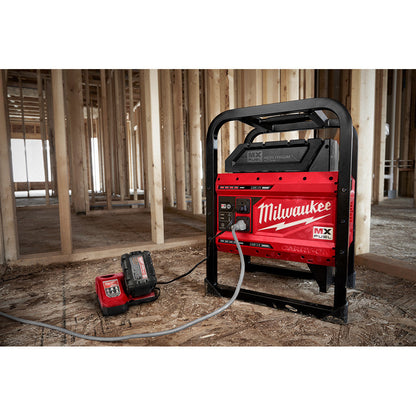 Milwaukee MXF002-2XC MX FUEL CARRY-ON Cordless 3600W/1800W Power Supply Generator Kit showing in use with a M18 charger