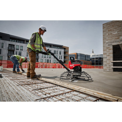 Milwaukee MXF336-3HD MX FUEL 36in Walk-Behind Edging Trowel Kit showing in use finish a concrete floor outside a building