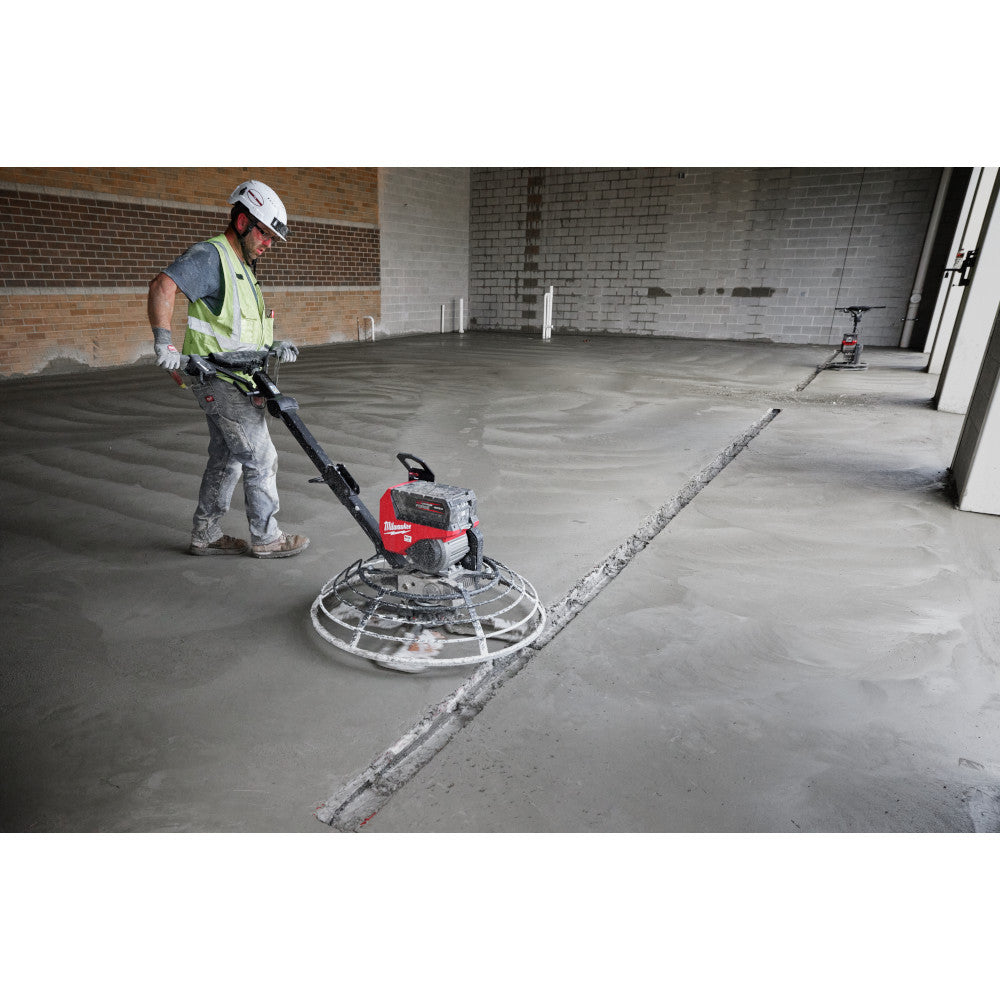 Milwaukee MXF336-3HD MX FUEL 36in Walk-Behind Edging Trowel Kit showing in use finish a concrete floor inside a building