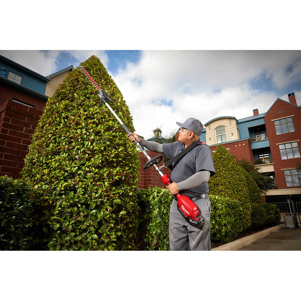 Milwaukee 49-16-2719 M18 FUEL QUIK-LOK Articulating 20 Hedge Trimmer Attachment trimming a hedge row