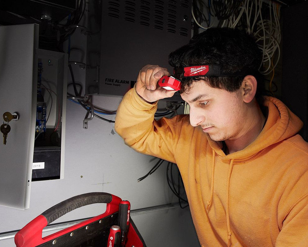 Milwaukee 2103 LED Headlamp illuminating a work area