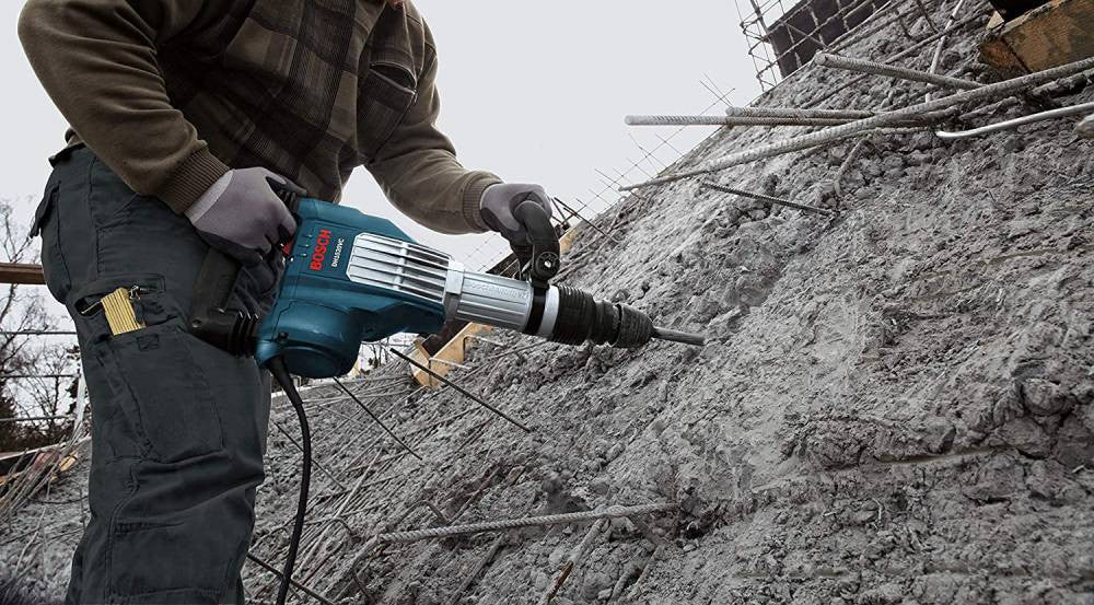 Bosch DH1020VC 15 Amp SDS-Max Demolition Hammer wrecking a cement wall