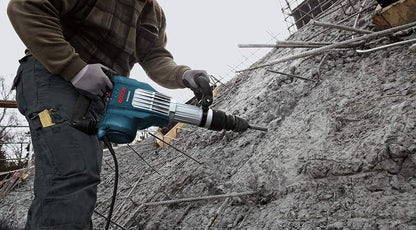 Bosch DH1020VC 15 Amp SDS-Max Demolition Hammer wrecking a cement wall