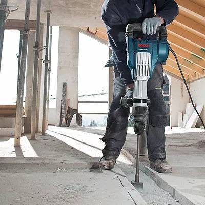 Bosch DH1020VC 15 Amp SDS-Max Demolition Hammer on the job hammering a floor