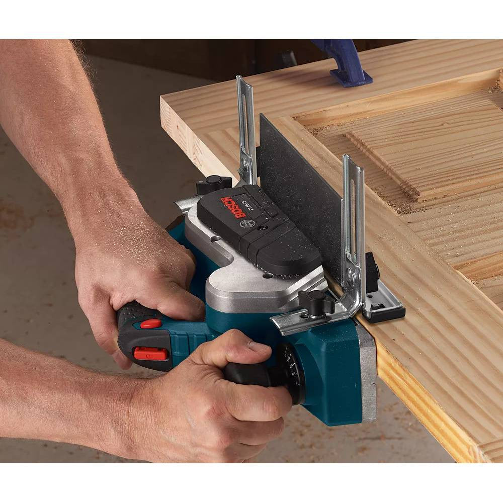 Bosch PL1632 3-1/4 inch Planer working on a door