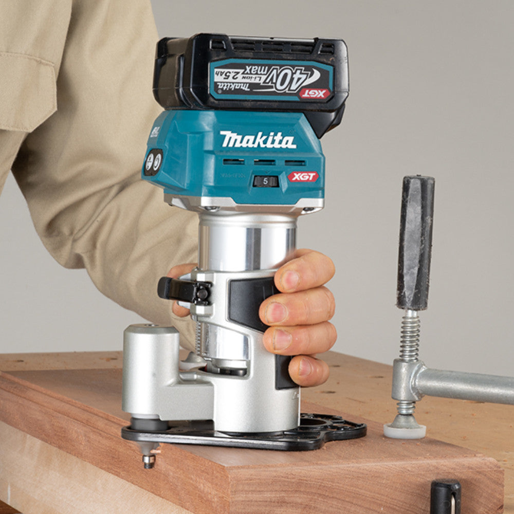 Makita RT001GZ01 40V Max XGT 1.5 HP Cordless Brushless Compact Router (Tool Only) showing in use cutting a edge with a off-set base (Off-set Sold separately)