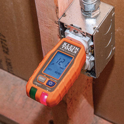 Klein Tools RT250 GFCI Receptacle Tester with LCD showing in use testing an interior electrical outlet