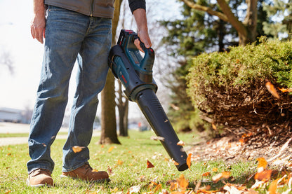 Bosch GBL18V-450N PROFACTOR 18V Cordless Brushless Blower (Tool Only) clearing leaves in yard