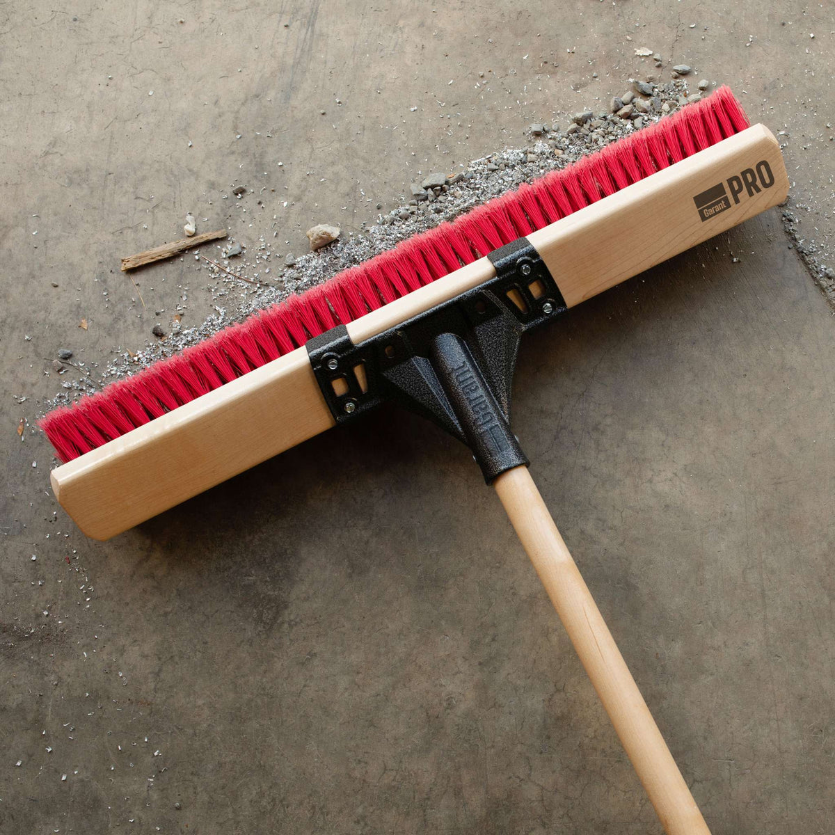 Garant Pro Series 24in Multi-Surface Push Broom with Wood Handle — broom head close-up