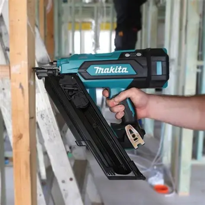 Makita DBN900ZK 18V LXT Cordless Brushless 3-1/2in 30° Framing Nailer (Tool Only) showing in use attaching cross bracing to a wood stud (Battery sold separately)