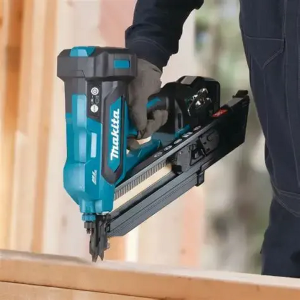 Makita DBN900ZK 18V LXT Cordless Brushless 3-1/2in 30° Framing Nailer (Tool Only) showing in use attaching two wood studs together (Battery sold separately)