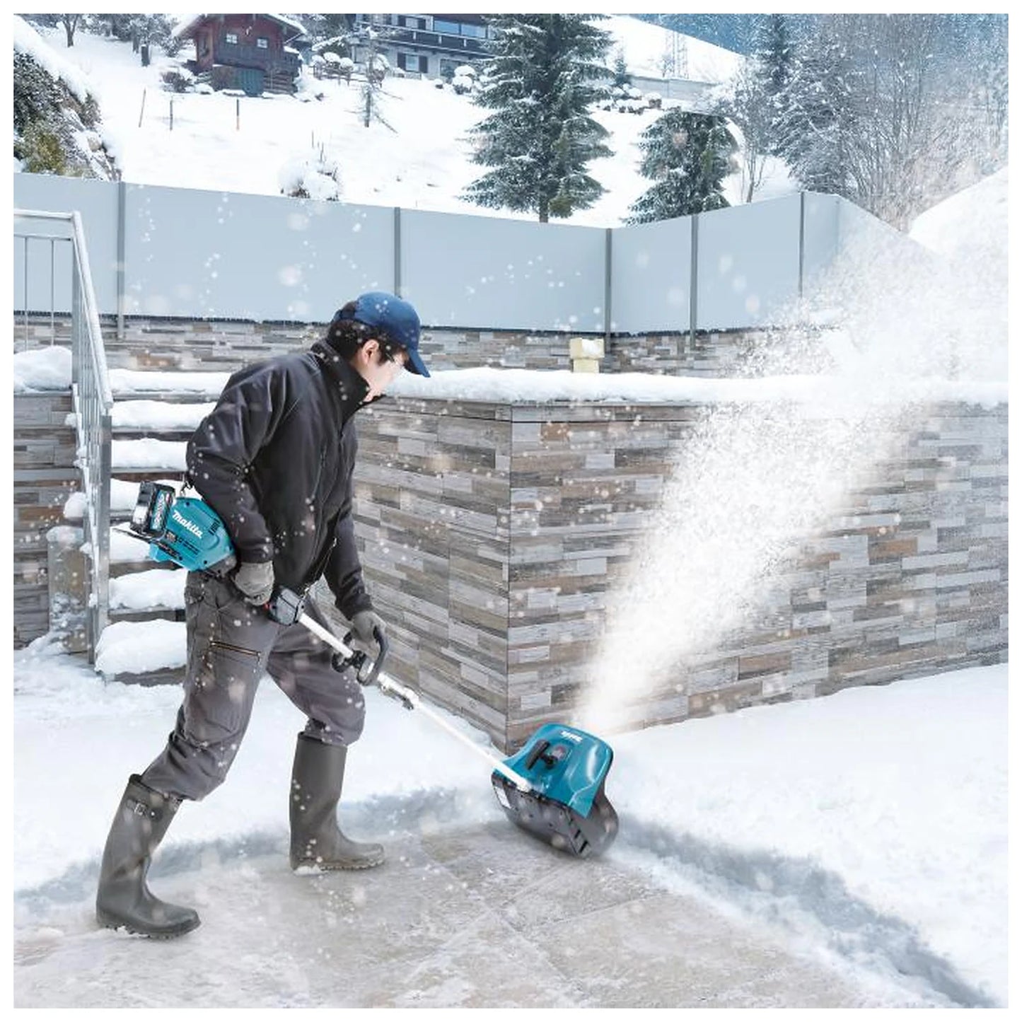 Makita SN400MP attachment clearing snow from a sidewalk