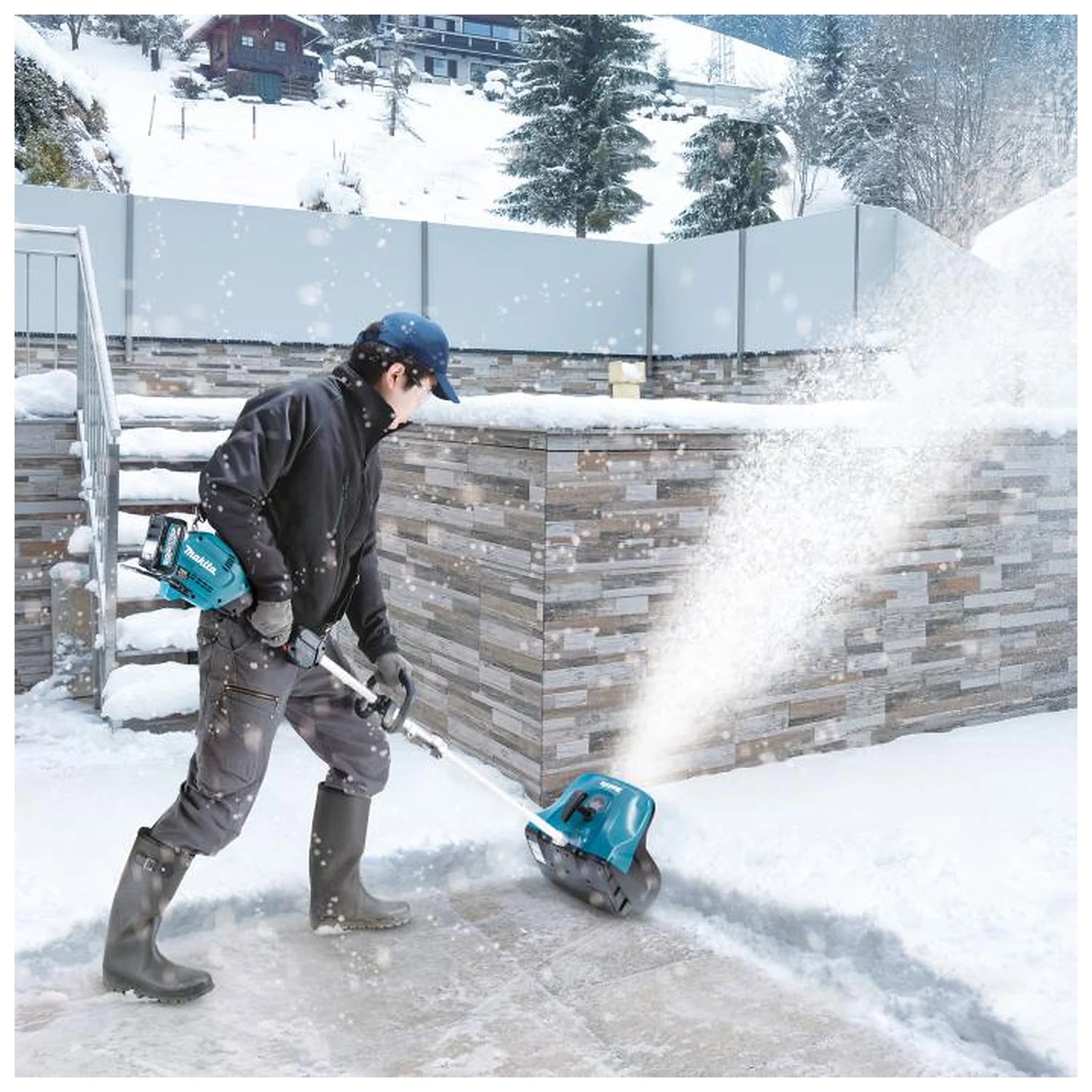 Makita SN400MP attachment clearing snow from a sidewalk