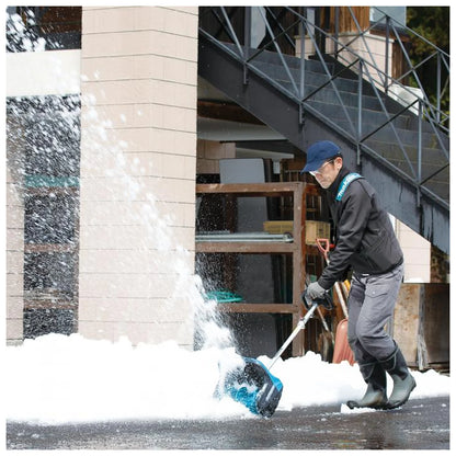 Makita SN400MP attachment clearing a snowy walkway