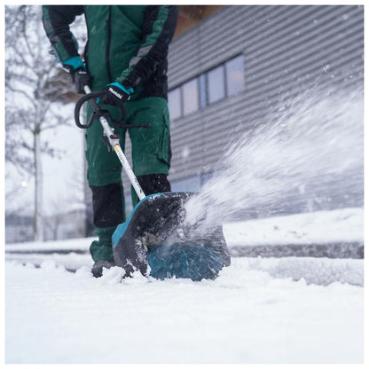 Makita SN400MP attachment throwing snow outside a building